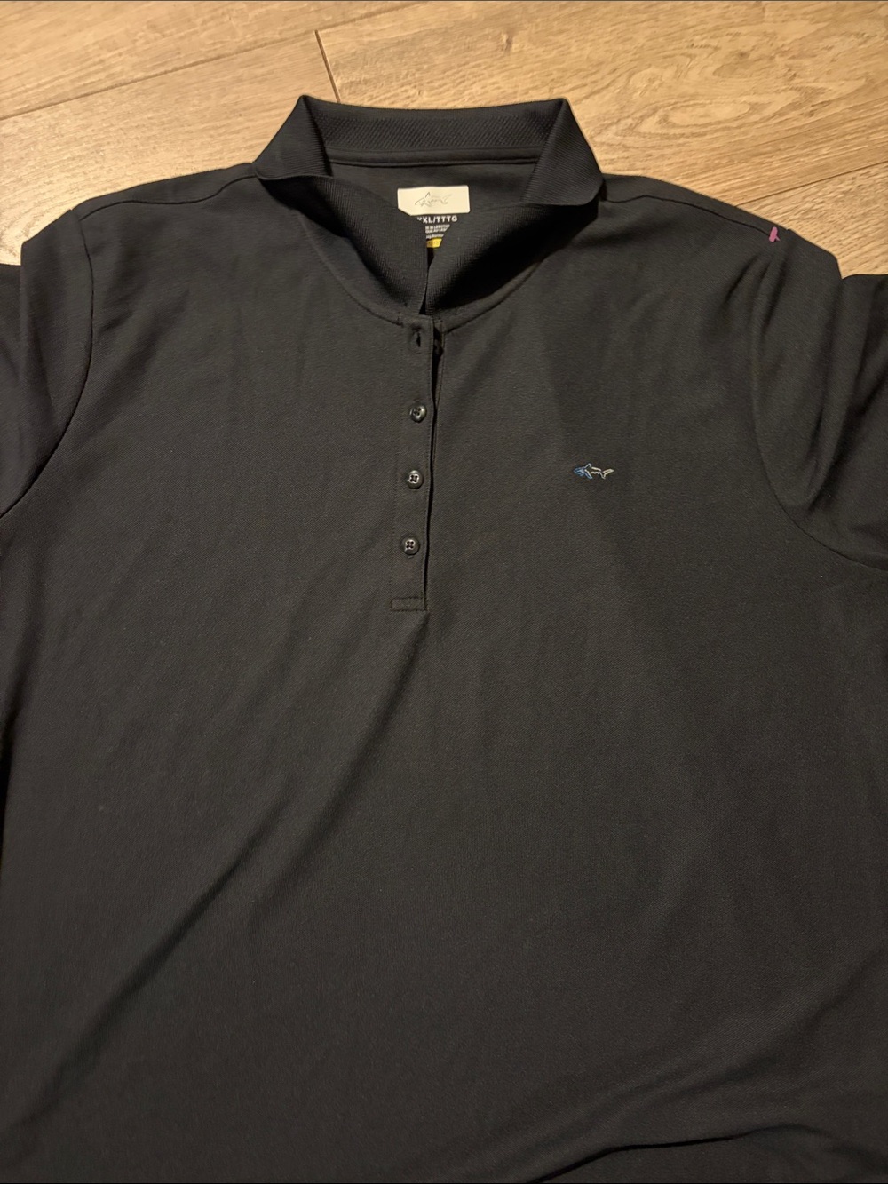 Greg Norman Collection Black Polo with Small Blue Shark Logo